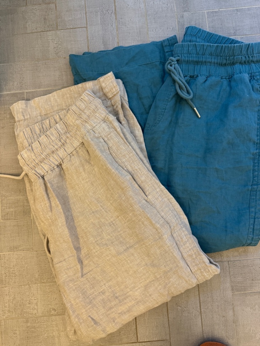 Two pair of Quince womens Elastic-Waist Wide-leg pants in Teal and Natural linen